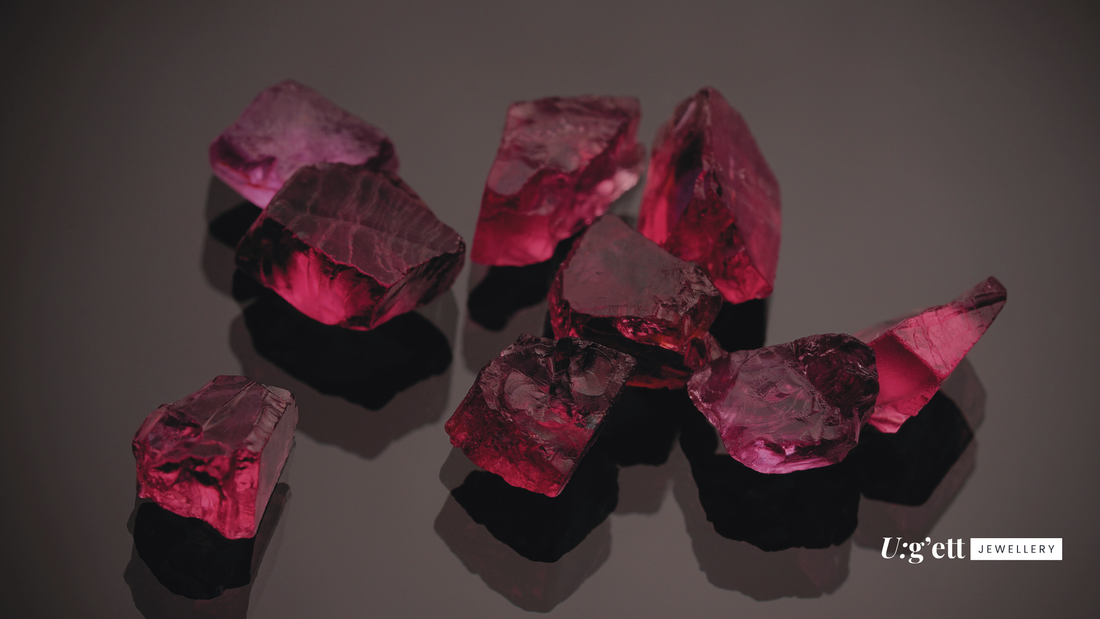 bright red raw natural gemstones on a plain background