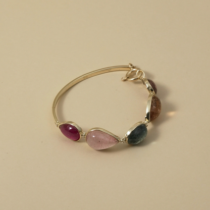 Cape Aura - The Cape’s natural splendour — from fynbos fields to the golden horizon. A multi-colour Tourmaline Cabochon Bracelet in 9 Kt Gold