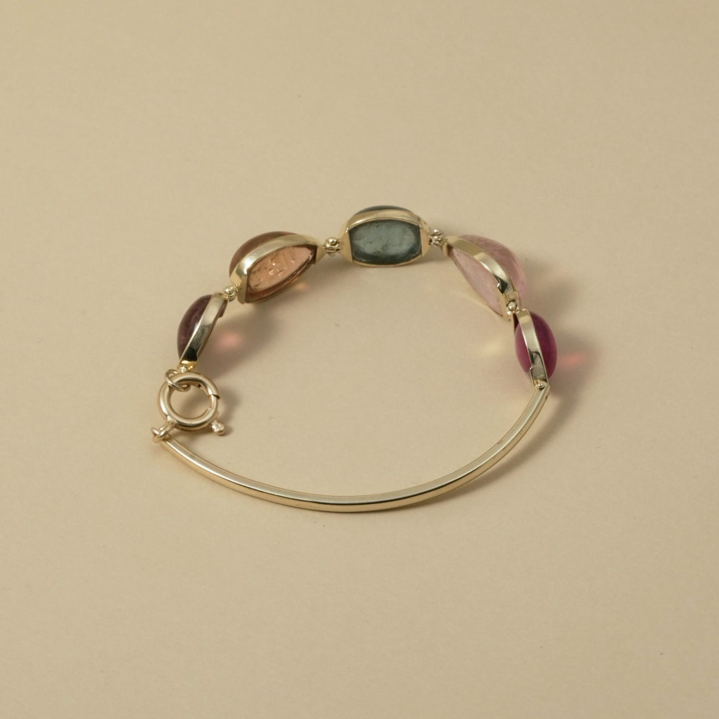 Cape Aura - The Cape’s natural splendour — from fynbos fields to the golden horizon. A multi-colour Tourmaline Cabochon Bracelet in 9 Kt Gold