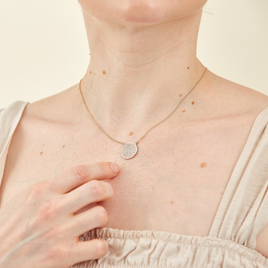 9 K Gold Necklace with Round Pendant encrusted with Pavé Set Diamonds