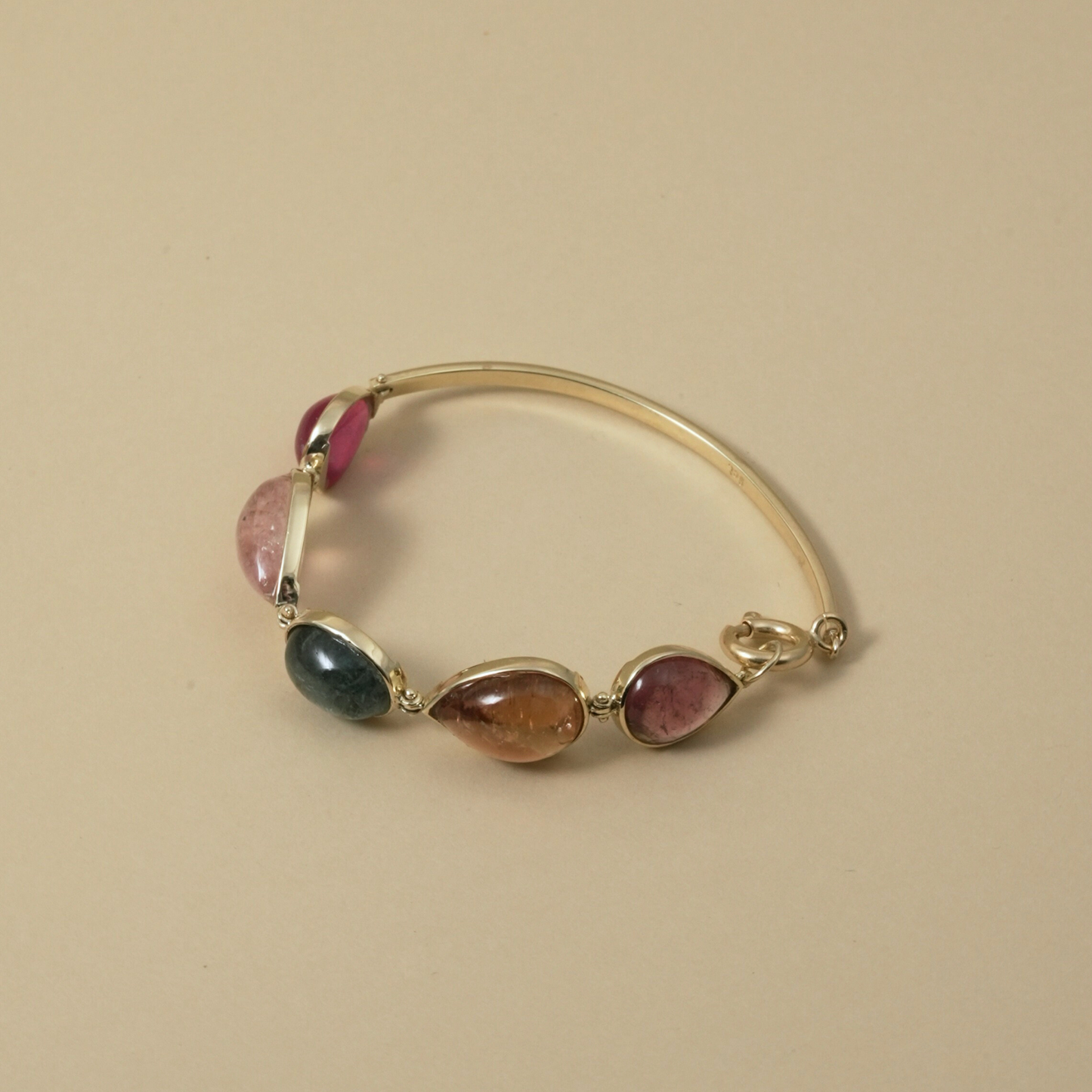 Cape Aura - The Cape’s natural splendour — from fynbos fields to the golden horizon. A multi-colour Tourmaline Cabochon Bracelet in 9 Kt Gold