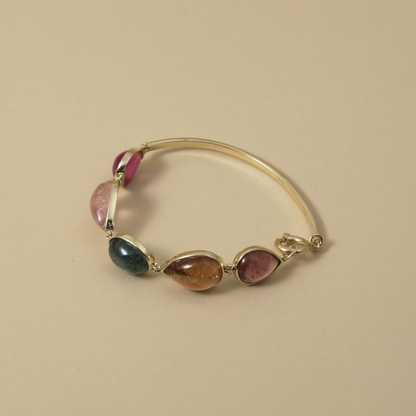 Cape Aura - The Cape’s natural splendour — from fynbos fields to the golden horizon. A multi-colour Tourmaline Cabochon Bracelet in 9 Kt Gold