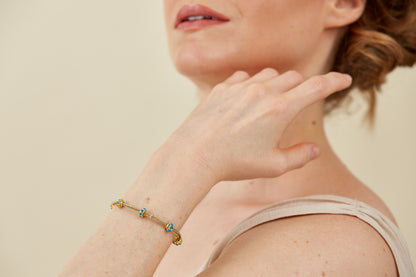Gold Bracelet with five Turquoise Enamel Accents in a Byzantine-Inspired Design