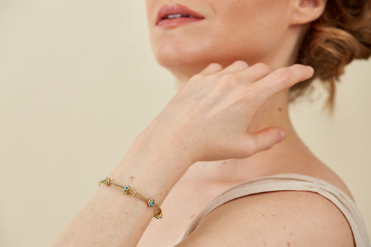Gold Bracelet with five Turquoise Enamel Accents in a Byzantine-Inspired Design