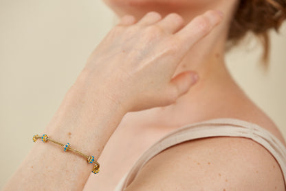Gold Bracelet with five Turquoise Enamel Accents in a Byzantine-Inspired Design