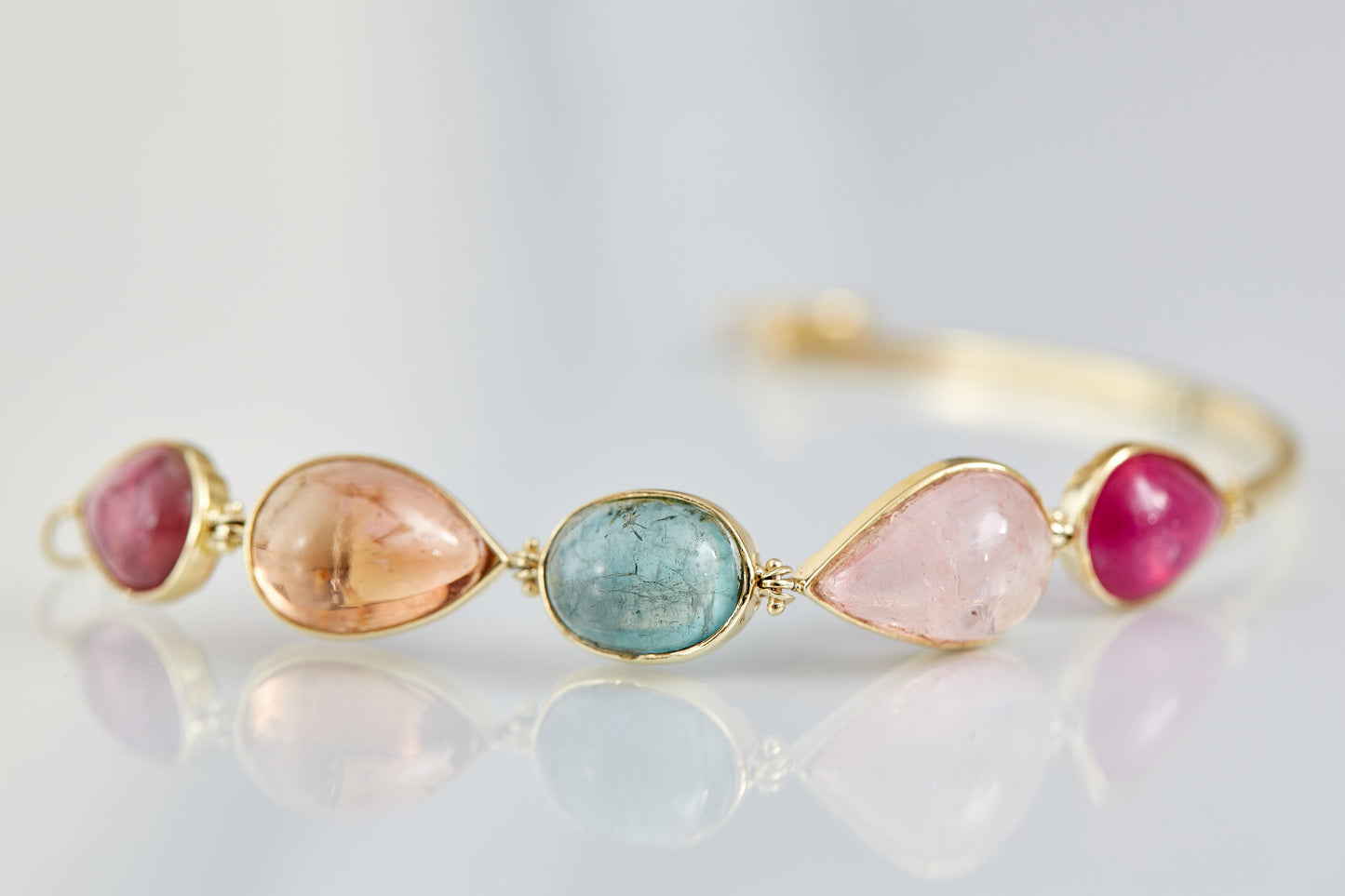 Cape Aura - The Cape’s natural splendour — from fynbos fields to the golden horizon. A multi-colour Tourmaline Cabochon Bracelet in 9 Kt Gold