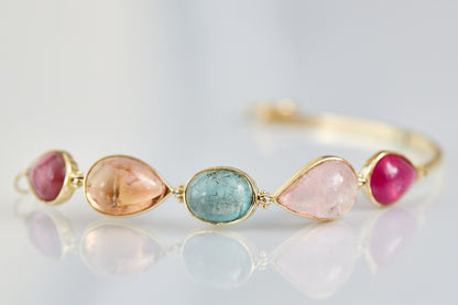 Cape Aura - The Cape’s natural splendour — from fynbos fields to the golden horizon. A multi-colour Tourmaline Cabochon Bracelet in 9 Kt Gold