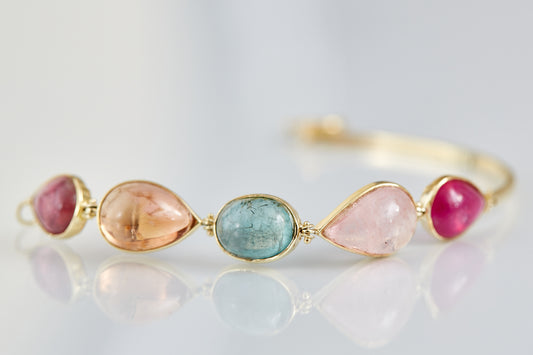 Cape Aura - The Cape’s natural splendour — from fynbos fields to the golden horizon. A multi-colour Tourmaline Cabochon Bracelet in 9 Kt Gold
