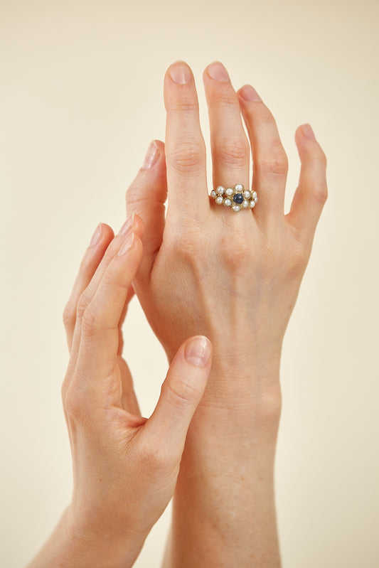 Half pearls with Cabochon Sapphire accent in 9 Kt yellow gold