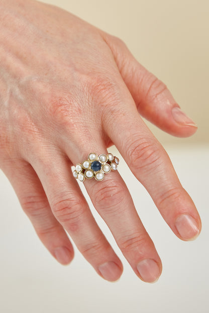 Half pearls with Cabochon Sapphire accent in 9 Kt yellow gold