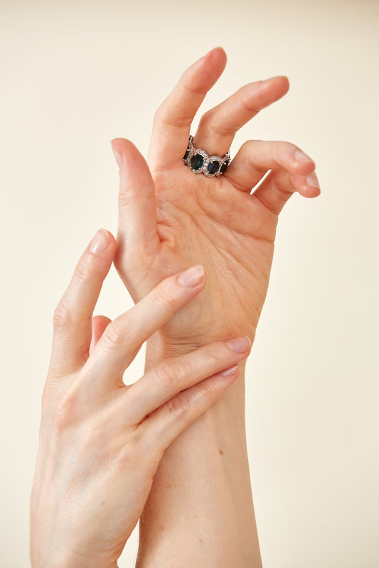 9 Kt gold ring set with green & blue precious gemstones surrounded diamonds