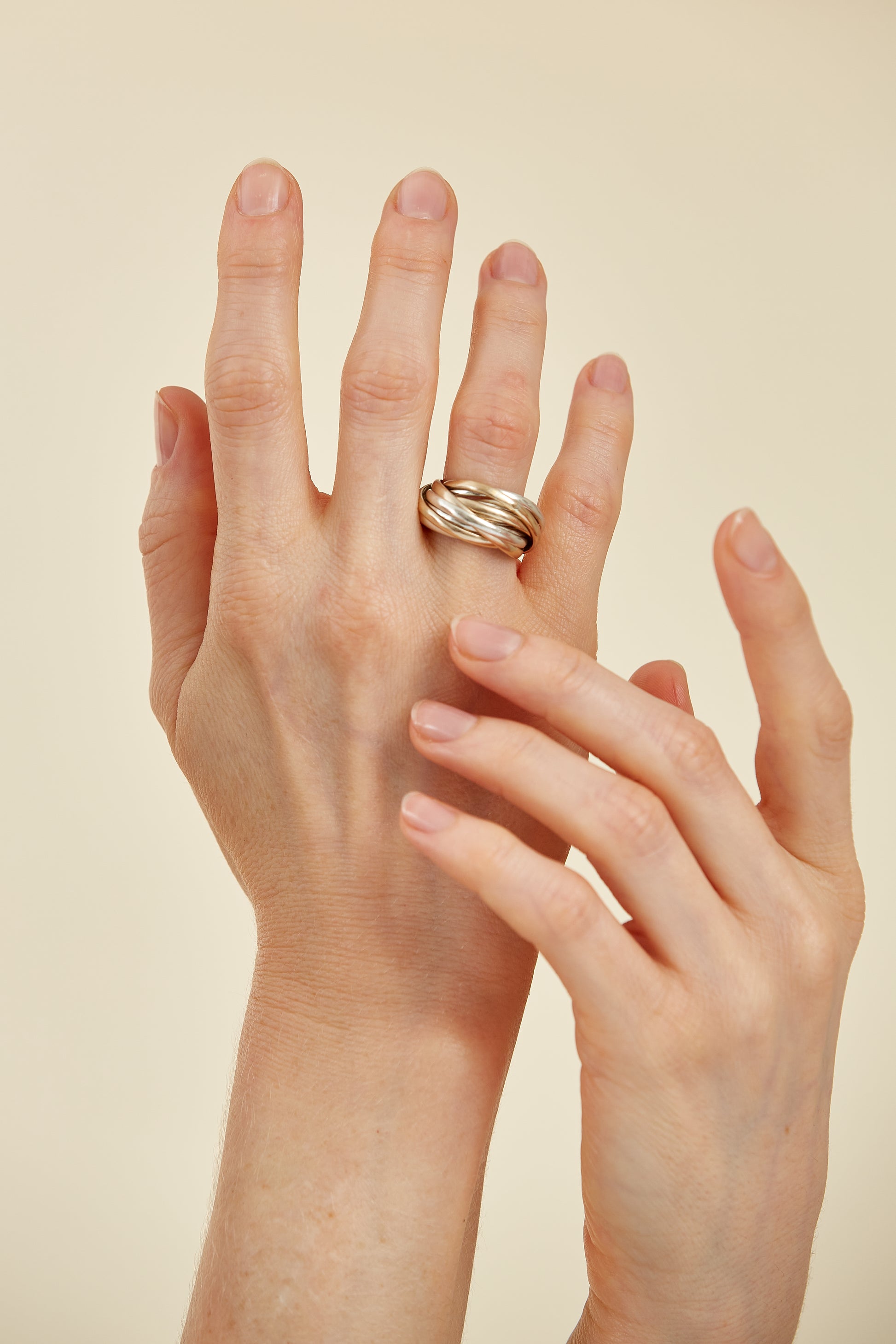 Trinity-style Russian wedding ring with interlocked yellow, white, and rose gold bands. A meaningful symbol of eternal love and unity.
