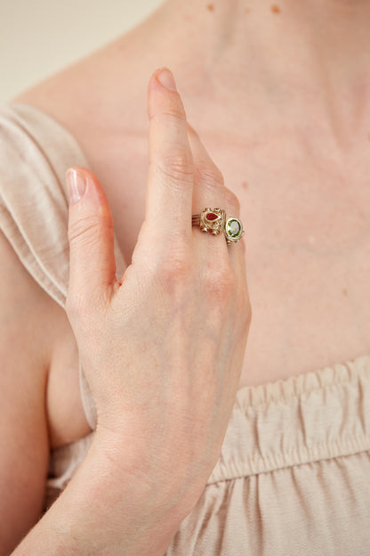 Oval Peridot with assorted assorted gemstone accents
