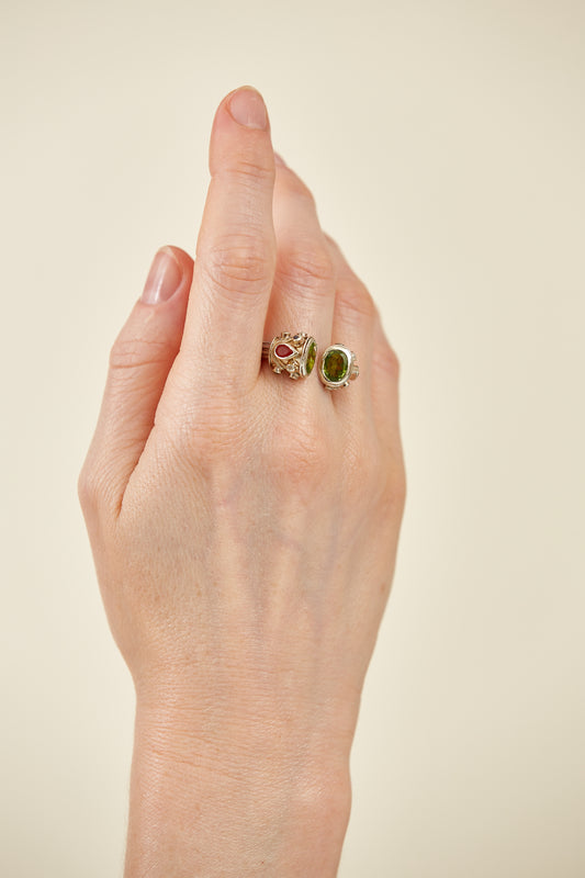 Oval Peridot with assorted assorted gemstone accents