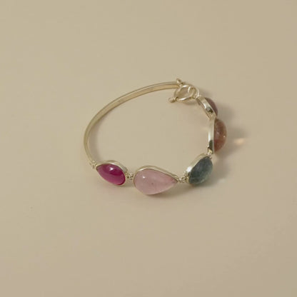 Cape Aura - The Cape’s natural splendour — from fynbos fields to the golden horizon. A multi-colour Tourmaline Cabochon Bracelet in 9 Kt Gold